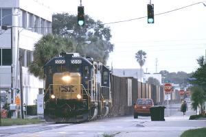 Long freight train operates on a
street.